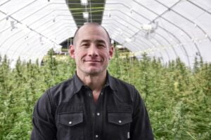 John Bayes pictured in Davis Farms Hemp Greenhouse for the Bhutan Glory project